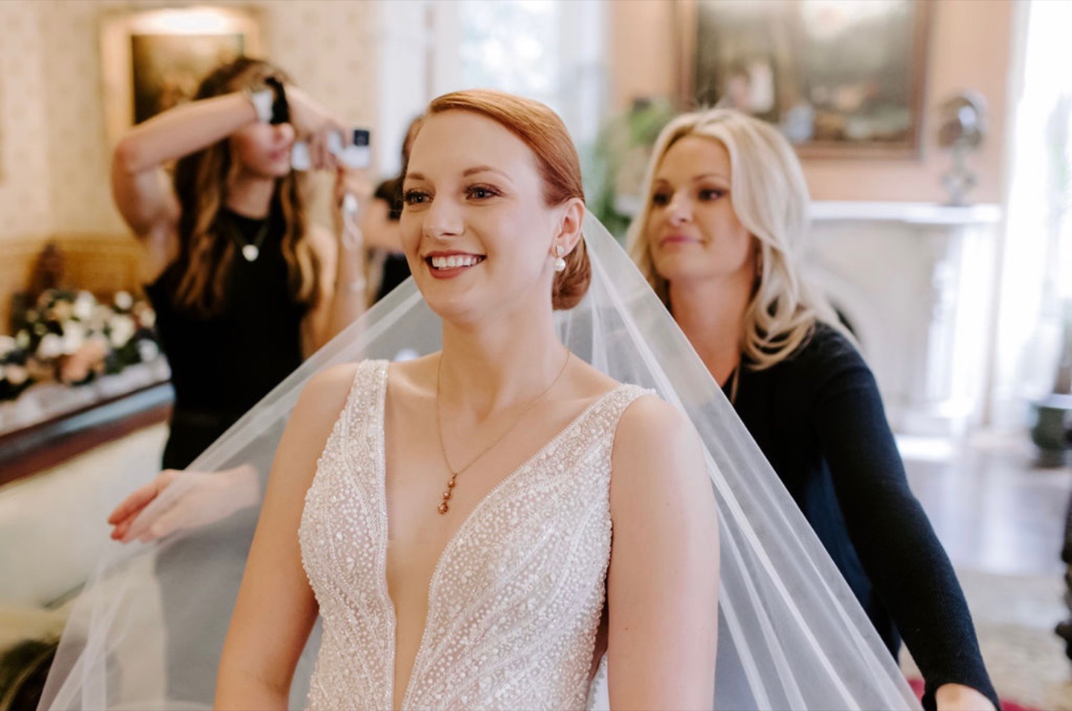 A bride in her veil, styled by Posh Hair Studio